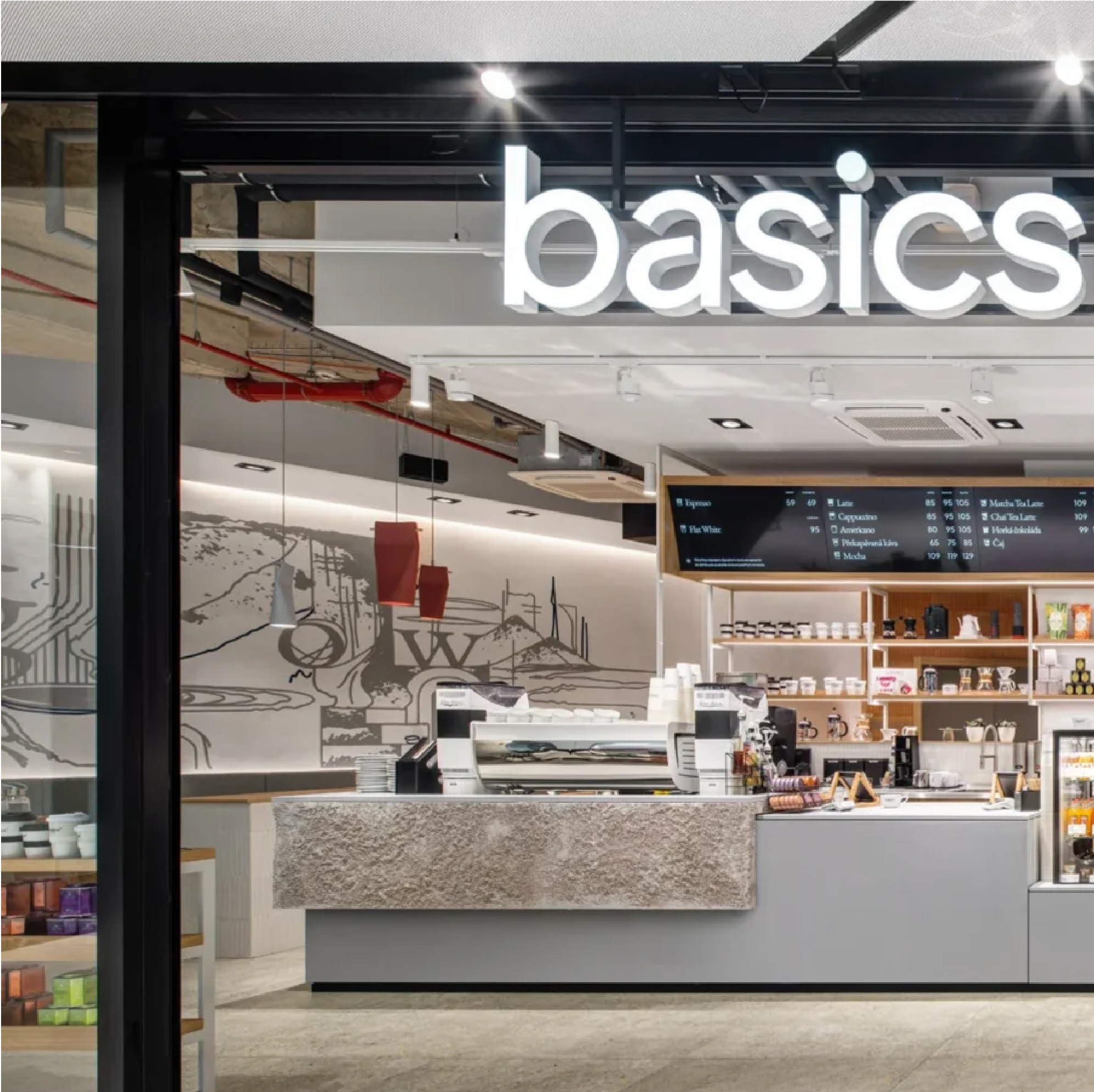 Basics Coffee café interior with textured counter, wood shelving, and hand-drawn mural by Archicraft